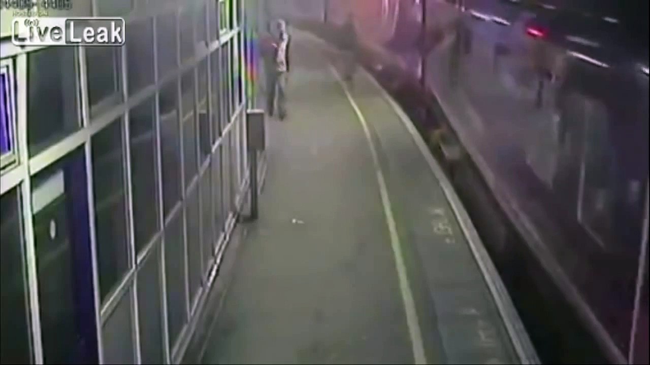 LiveLeak - Drunk guy falls under train and somehow is unharmed