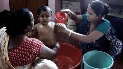 child Bathing In A Bucket