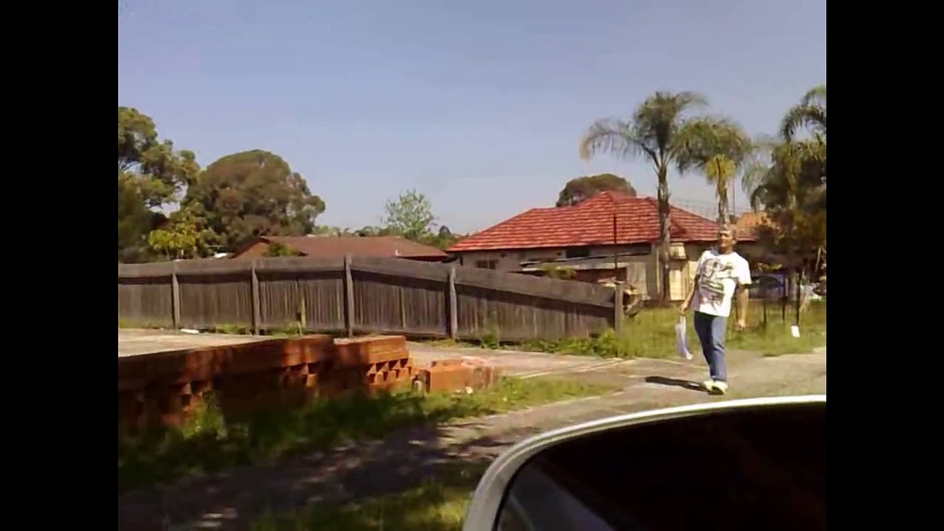 Aussie Drunk Man walk through fence on Make a GIF