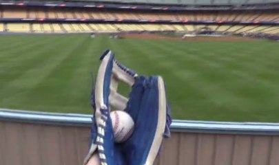 This man has caught hundreds of Major League Baseball home run balls.. with a camera in his other hand