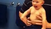 Baby adorably flexes muscles with dad (480p)