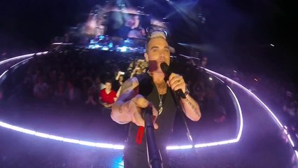 Robbie William borrows a fan's camera to take a Selfie