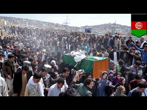 Afghan woman beaten, dragged and burned after falsely accused of burning Koran