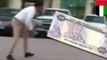 Make it rain: Money falling from the sky in Jumeirah, Dubai as UAE Dirham banknotes fly