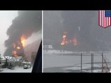 Train derails and explodes into flames, sets house on fire and leaks oil into a river too