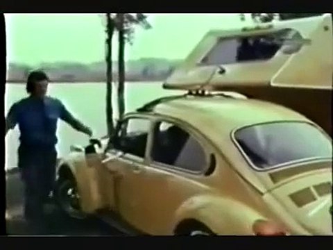 VW beetle towing a camper