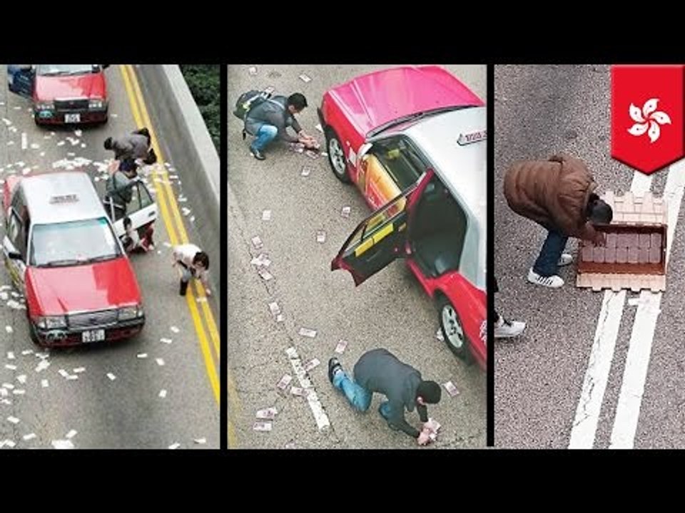 Hong Kong Xmas windfall: Armored car spills $4.5 million along a busy road in Wanchai