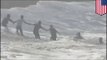 Faith in humanity restored: Beachgoers form human chain to save stranded swimmer