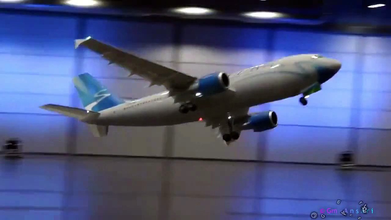 Amazing airplane flying under building 2015