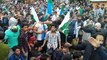 Kashmiris waves Pakistani Flags