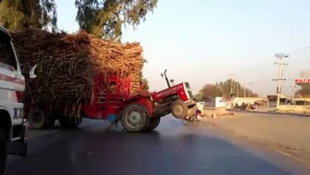 Tractor merging on the highway going from Sahiwal to Lahore in Pakistan.