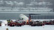 Plane skids off runway at NYC airport during snowstorm