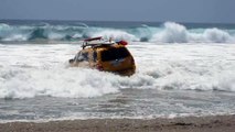 Car Gets Taken By Large Waves At Zuma Beach, California