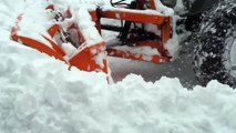 Lamborghini tractor plowing snow and stuck in it