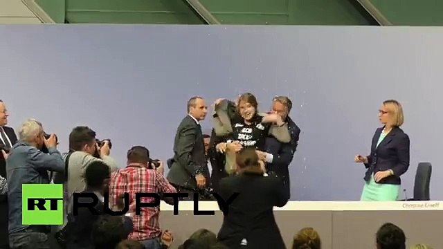 Jump Around: Protester Besieges ECB President Draghi, Disrupts Presser | RT