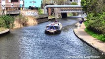 London. River Boat Passing a Lock on a Channel in Limehouse. River Thames