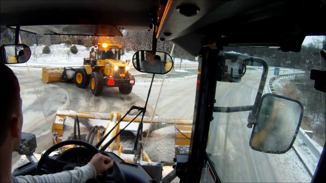 Two Komatsu WA200 Loaders Plowing In Convoy