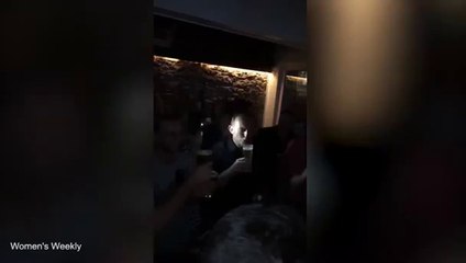 Australian PM Tony Abbott skols beer as crowd cheers on