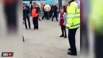 Police officer female skills with kids beore Aston Villa - Liverpool FA Cup