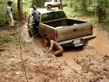 HOT CHICK FALLS IN MUD WHILE PULLING OUT CHEVY 4X4 MUD TRUCK FAIL - Red River Mud Bog