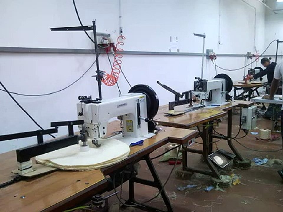 Automated polishing wheels sewing machine with spiral sewing device