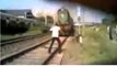 OMG watch this man he is in front of high speed train it can be dangerous for him we should avoid this type of fun,infoprovider