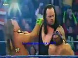 Undertaker chokeslams Rey Mysterio and Shawn Michaels