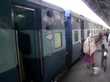 Train leaving station at Agra, India - Human waste on tracks