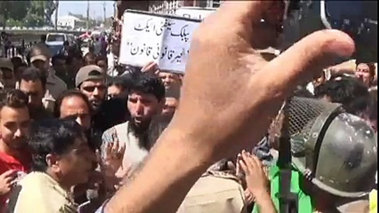 People protesting against the use of PSA on Masarat Alam