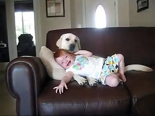 Baby and dog having fun