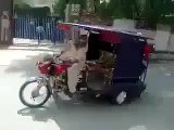 Chingchi Rickshaw Doing One Wheeling