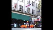 Guy rides BMX bike on Lamborghini