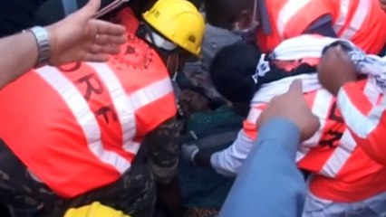 Woman pulled from Nepal debris alive