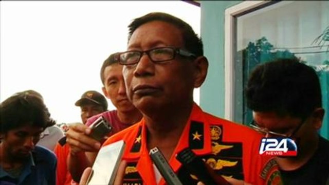 AirAsia plane tail lifted from seabed