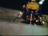 Moon Landing Hoax Apollo 16 : Two Stagehands Are Seen in The Fake Moon Bay Next To An Astronaut