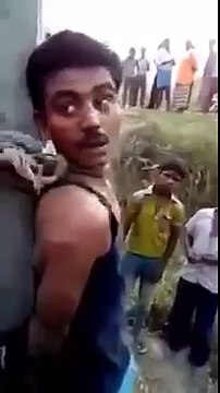 Indian Hindus beating a Muslim and forcing him to convert...