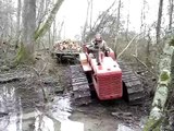 Amazing TD9 International skidding wood through muddy river