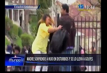 Madre sacó a golpes a su hijo de protestas en Baltimore