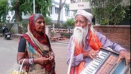 old man singing on streets