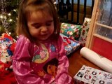 The Cutest Toddler Struggles to Open Her Tightly Wrapped Christmas Holiday Gifts.