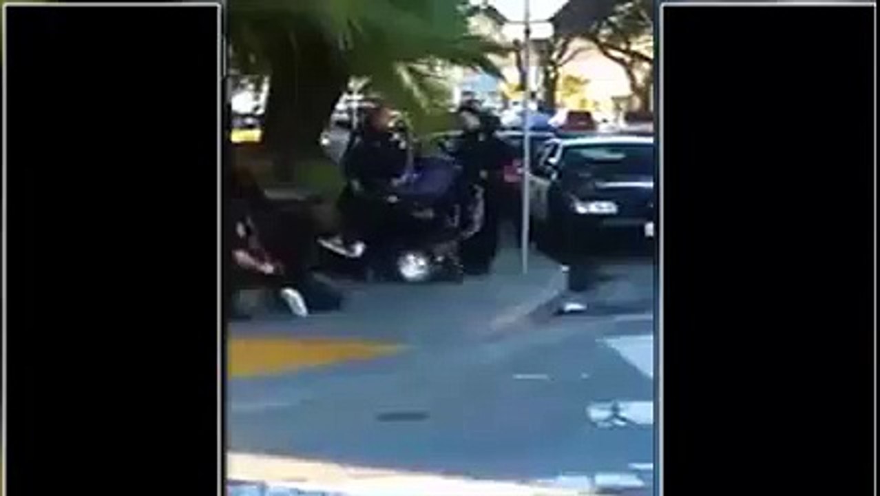 Cop filmed on cellphone trying to tip handicapped black man out of wheelchair