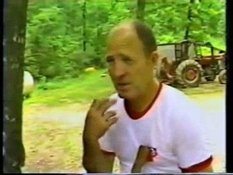 Tom Clark splitting wood using Buster