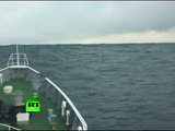 Tsunami Climbing: Incredible video of ship heading into wave in Japan