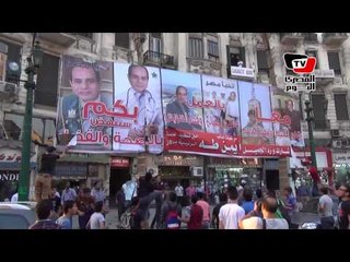 تمزيق لافتات للسيسي بميدان طلعت حرب