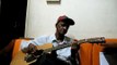 sir theo fernandes on acoustic guitar