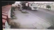 A truck full of drinks narrowly avoids a pedestrian