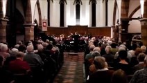 Man sneezes into his trombone during concert