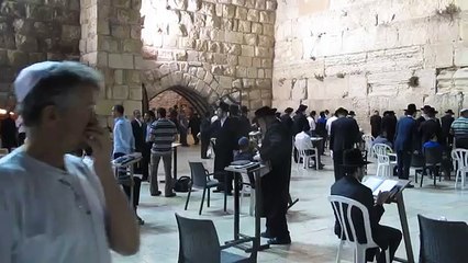 The Western Wall (Wailing Wall),  In the background, a Jewish prayer.