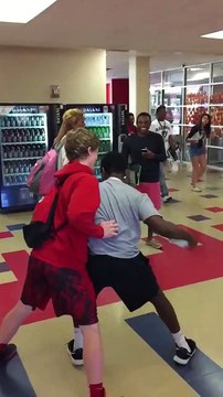 Kid hits teacher in the face with bottle : basketball headshot!