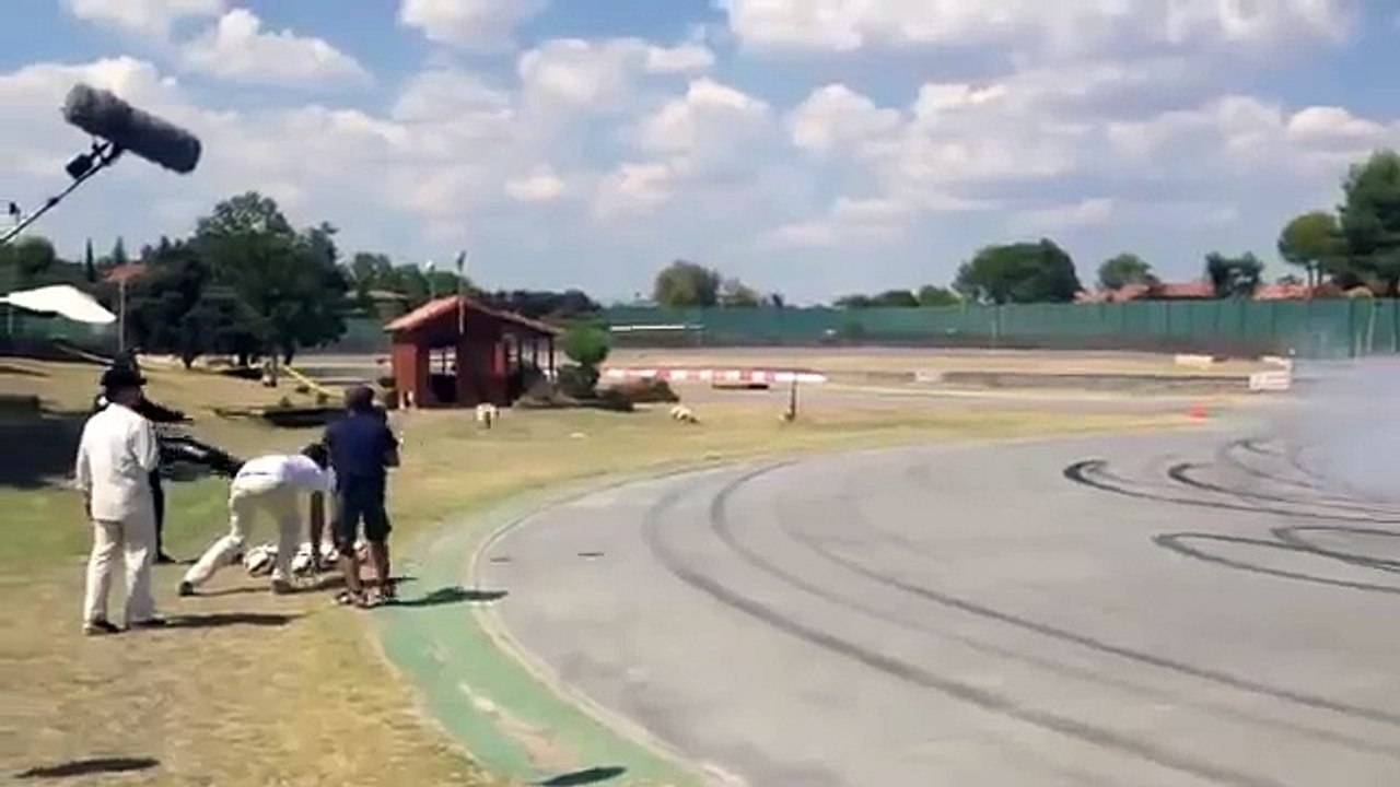 Cristiano Ronaldo shooting balls on the track with Jenson Button